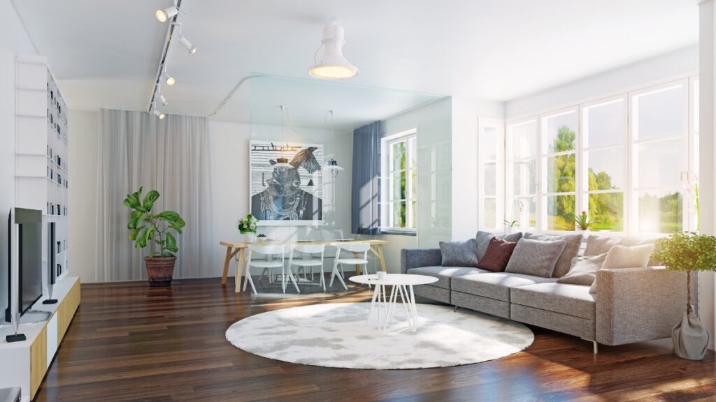 Professional house cleaners refreshing a bright family room.