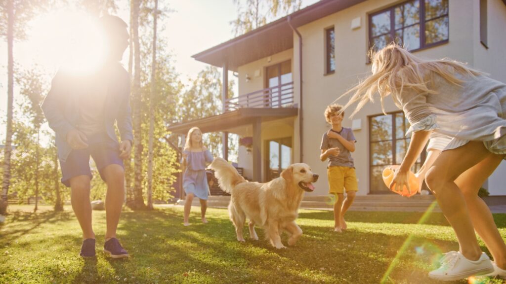 Family enjoying their home and yard with local residential cleaning services.